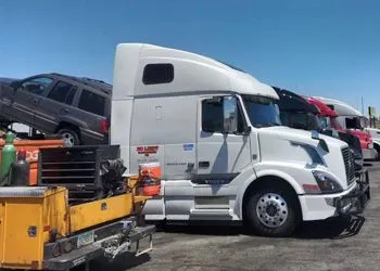 a group of trucks parked in a parking lot