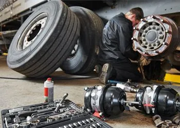 a man working on a vehicle